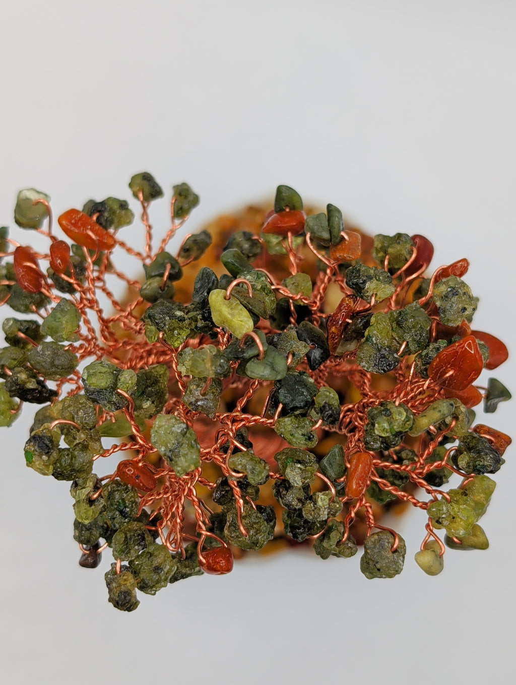 Pure honey amber base with peridot foliage